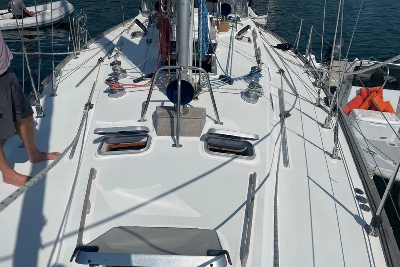 Slide: The Image of Sailboat deck of 1989 Cambria 44/46, featuring winches and rigging. - 8