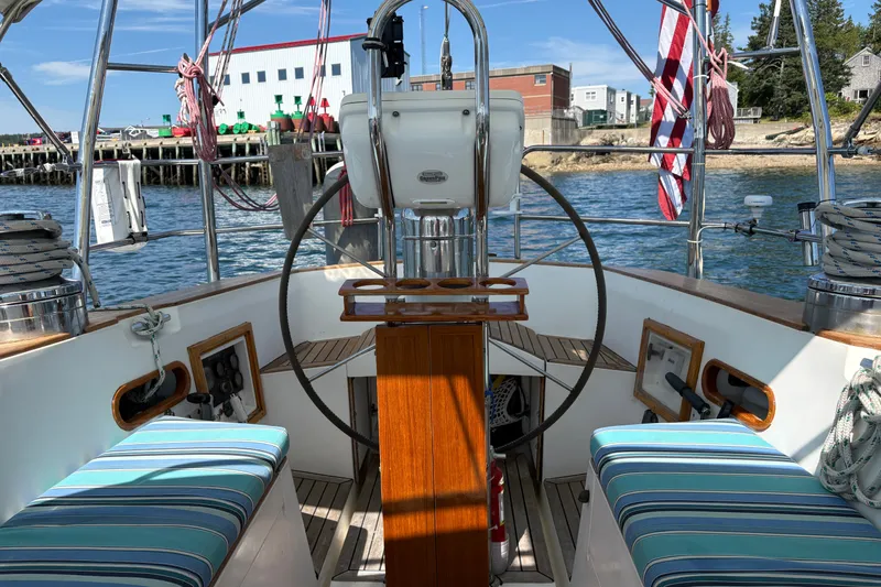 Slide: The Image of Cockpit of a 1989 Cambria 44/46 sailboat with striped seating and steering wheel. - 17