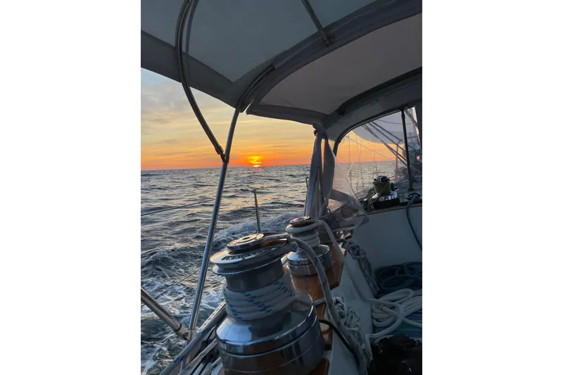 Slide: The Image of Sailing at sunset on a 1989 Cambria 46 yacht, ocean view. - 5