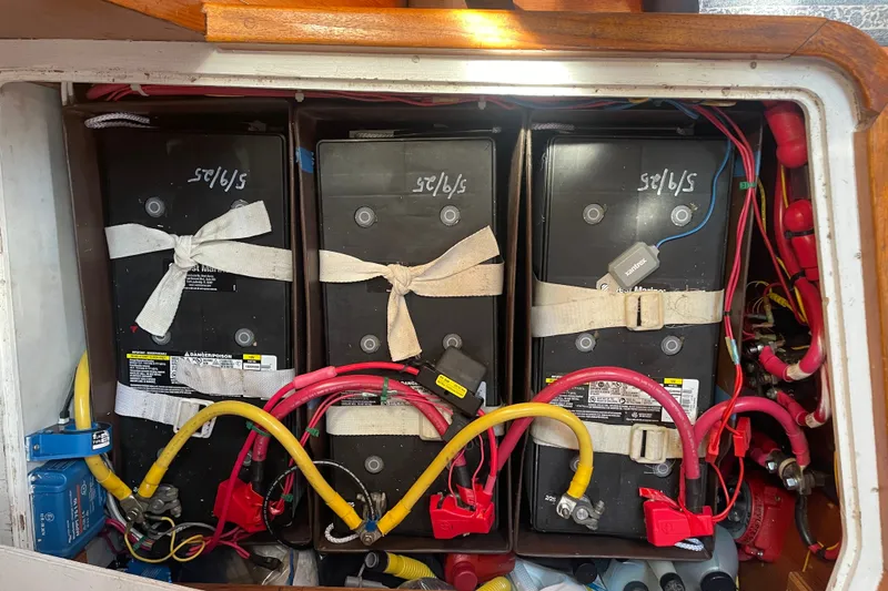 Slide: The Image of Battery compartment of a 1989 Cambria 44/46 sailboat with secured marine batteries. - 33
