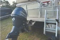 Slide: The Image of 2017 SMOKERCRAFT boat with Yamaha outboard motor and ladder on grassy area. - 9