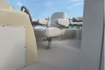 Slide: The Image of 2017 SMOKERCRAFT boat interior with steering wheel and cushioned seat under blue sky. - 6