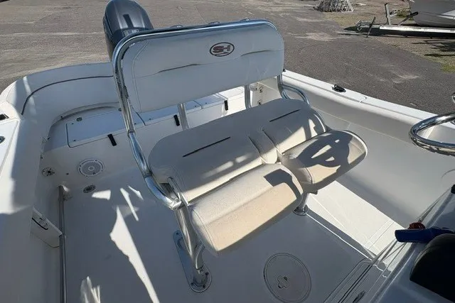 Slide: The Image of 2020 Sea Hunt Ultra 225 boat interior with dual seating and steering wheel. - 9