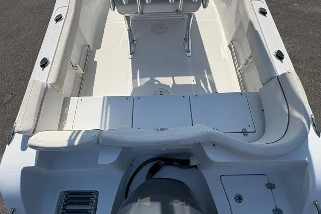 Slide: The Image of 2020 Sea Hunt Ultra 225 boat interior with seating and storage compartments. - 4