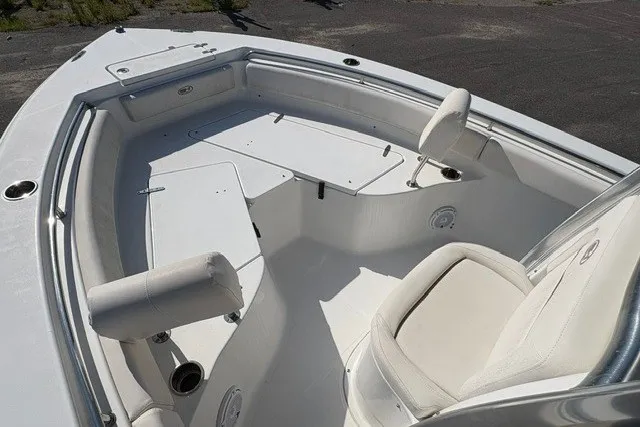 Slide: The Image of 2020 Sea Hunt Ultra 225 boat interior with seating and storage compartments. - 12