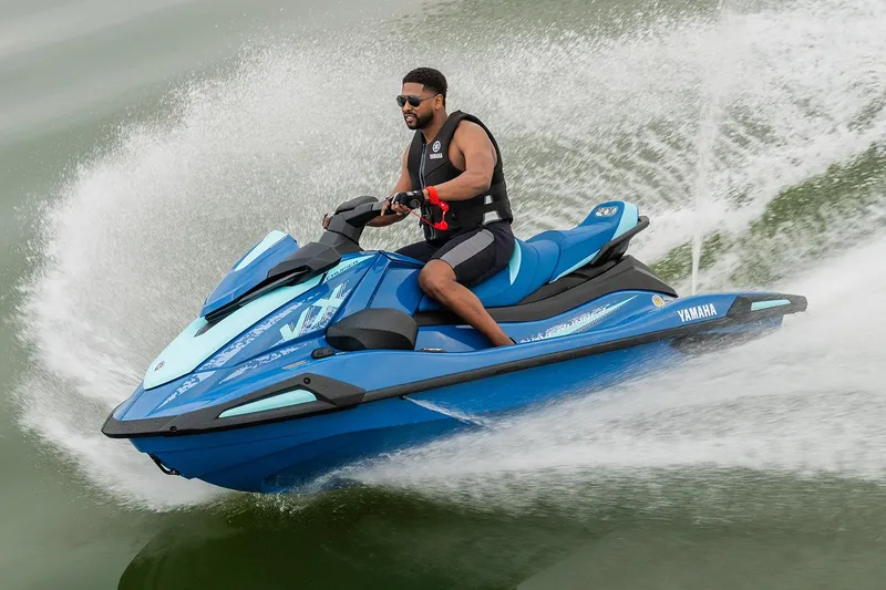 The Image of Manufacturer Provided Image: 2026 Yamaha WaveRunner VX Cruiser in action on water, rider wearing life vest. - 0