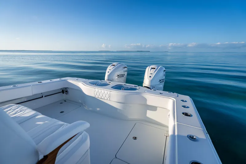 Slide: The Image of Freeman 35 boat, 2026 model, on calm ocean waters under clear blue sky. - 26