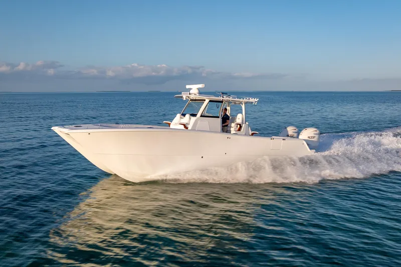 The Image of 2026 Freeman 35 boat cruising on open water under clear blue sky. - 0