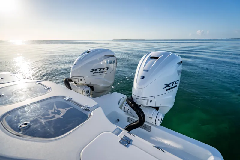 Slide: The Image of 2026 Freeman 35 boat with Yamaha XTO Offshore engines on calm ocean waters. - 30