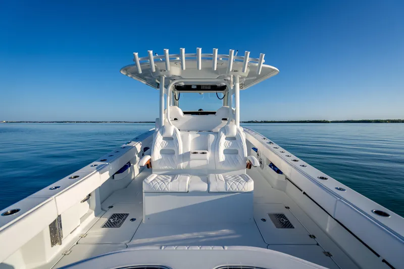 Slide: The Image of 2026 Freeman 35 boat on calm water, featuring sleek white seating and modern design. - 32