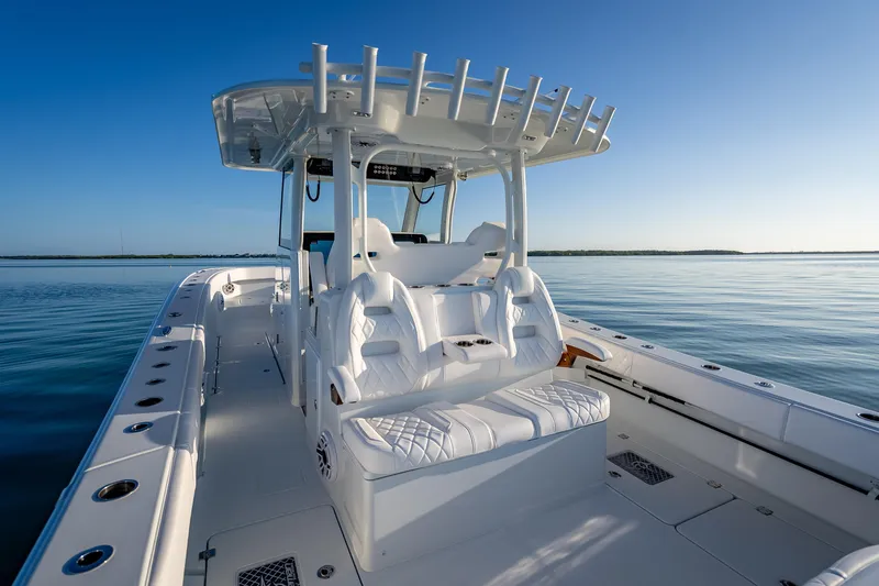 Slide: The Image of 2026 Freeman 35 boat interior with white seating on calm water. - 33