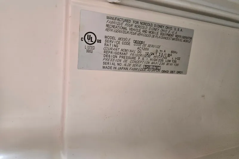 Slide: The Image of Label on a 2006 Sea Ray 240 Sundancer, detailing refrigeration specifications. - 60