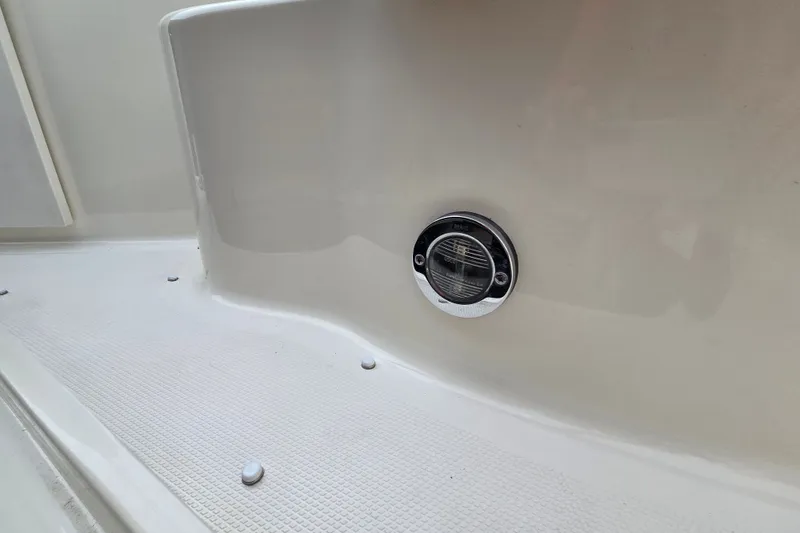 Slide: The Image of 2006 Sea Ray 240 Sundancer boat deck with chrome vent detail. - 23