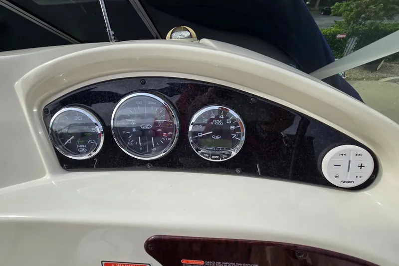 Slide: The Image of Dashboard of 2006 Sea Ray 240 Sundancer boat with gauges and controls. - 29