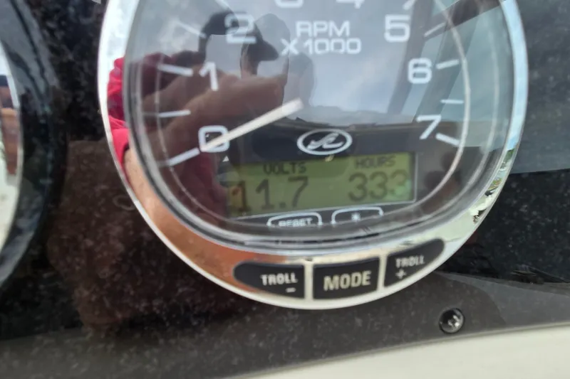 Slide: The Image of Close-up of a 2006 Sea Ray 240 Sundancer tachometer displaying RPM and hours. - 57