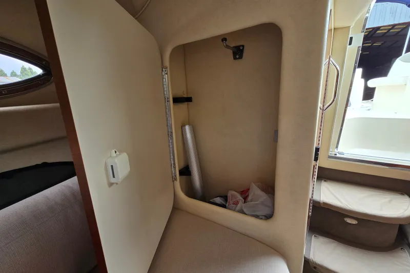Slide: The Image of Interior storage compartment of a 2006 Sea Ray 240 Sundancer boat. - 51