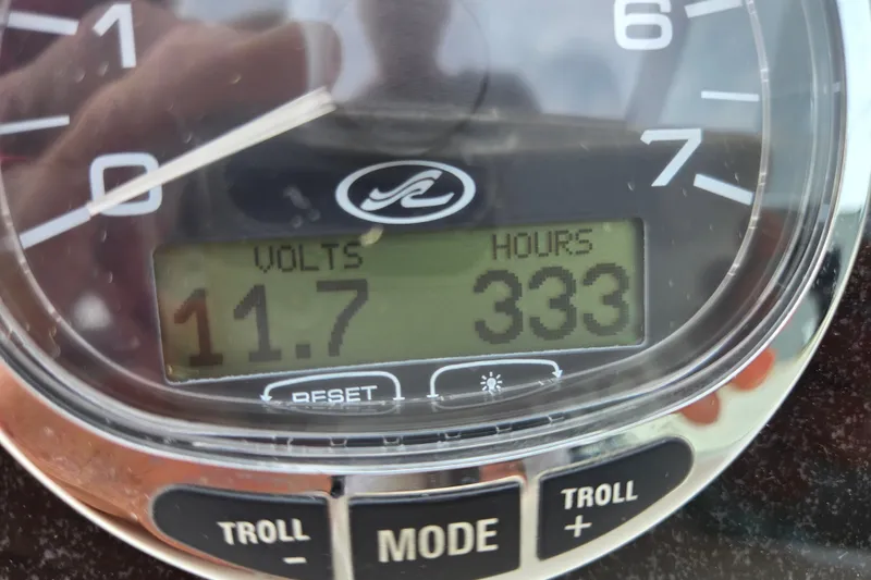 Slide: The Image of Close-up of a 2006 Sea Ray 240 Sundancer gauge showing 11.7 volts and 333 hours. - 39