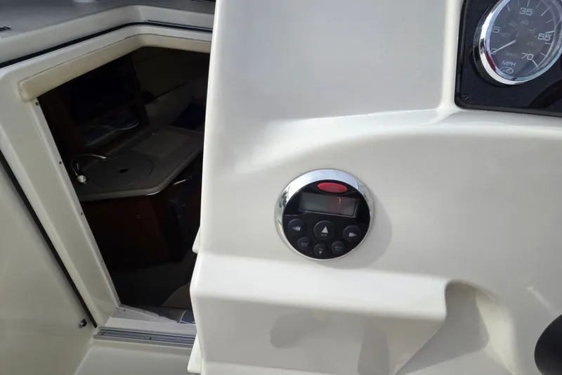 Slide: The Image of 2006 Sea Ray 240 Sundancer cabin entrance and control panel detail. - 31