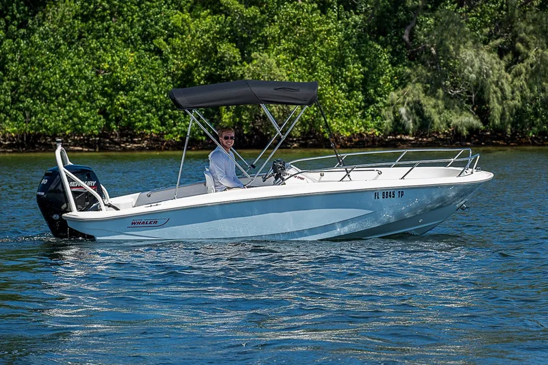 Slide: The Image of 2022 Boston Whaler 160 Super Sport boat cruising on a sunny day. - 19
