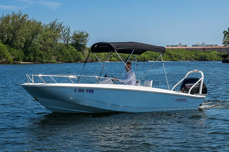 The Image of 2022 Boston Whaler 160 Super Sport boat cruising on a sunny day. - 9