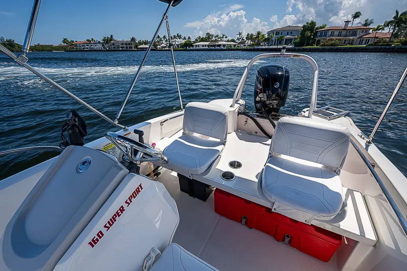 Slide: The Image of 2022 Boston Whaler 160 Super Sport boat interior on a sunny day. - 3