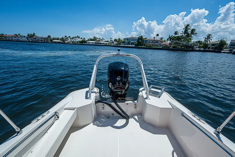 Slide: The Image of 2022 Boston Whaler 160 Super Sport on a sunny day, cruising on a scenic waterway. - 5