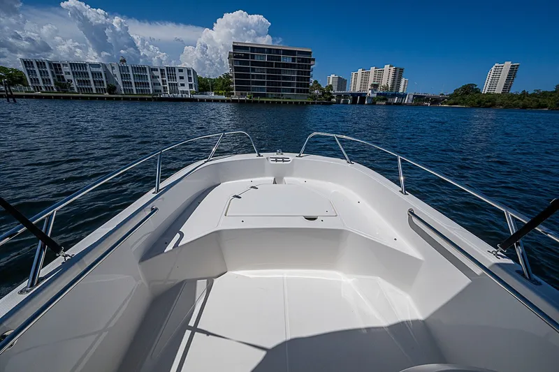 Slide: The Image of 2022 Boston Whaler 160 Super Sport on water, city skyline in background. - 8