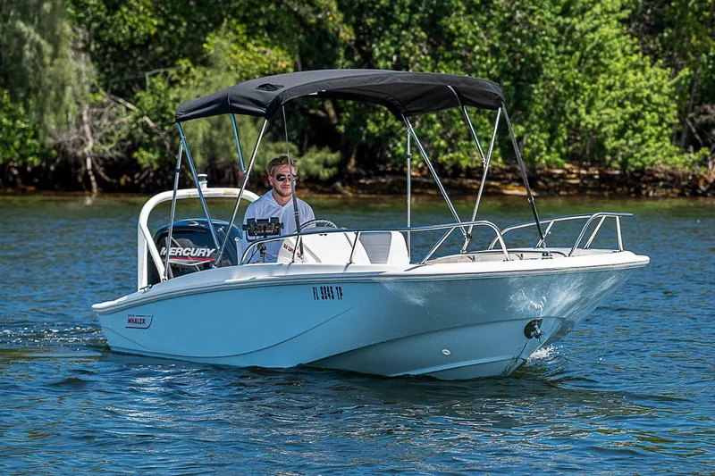 Slide: The Image of 2022 Boston Whaler 160 Super Sport boat cruising on a sunny day. - 22