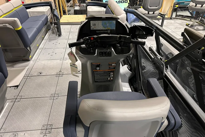 Slide: The Image of Interior view of 2025 Sea-Doo Switch Cruise Limited 21, featuring helm and seating area. - 13