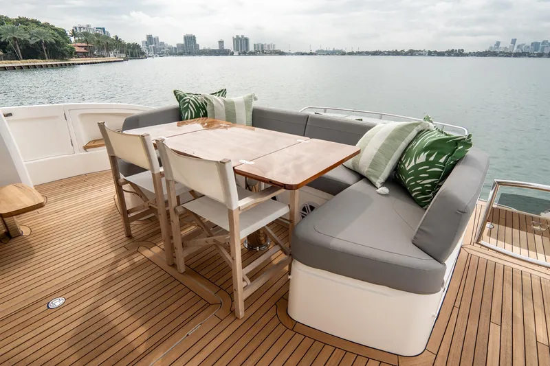 Slide: The Image of Luxurious 2017 Princess S65 yacht deck with elegant seating and scenic waterfront view. - 47
