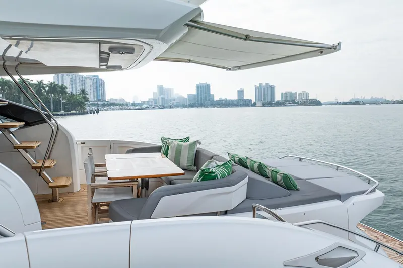 Slide: The Image of Luxurious 2017 Princess S65 yacht with elegant outdoor seating and scenic waterfront view. - 41