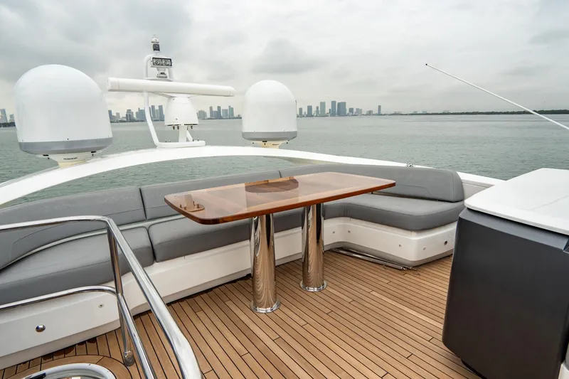 Slide: The Image of Luxurious 2017 Princess S65 yacht deck with seating and table, overlooking city skyline. - 37