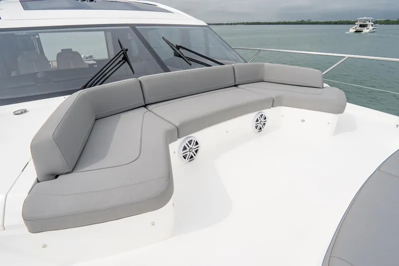 Slide: The Image of Luxurious seating area on 2017 Princess S65 yacht, featuring sleek design and ocean backdrop. - 49