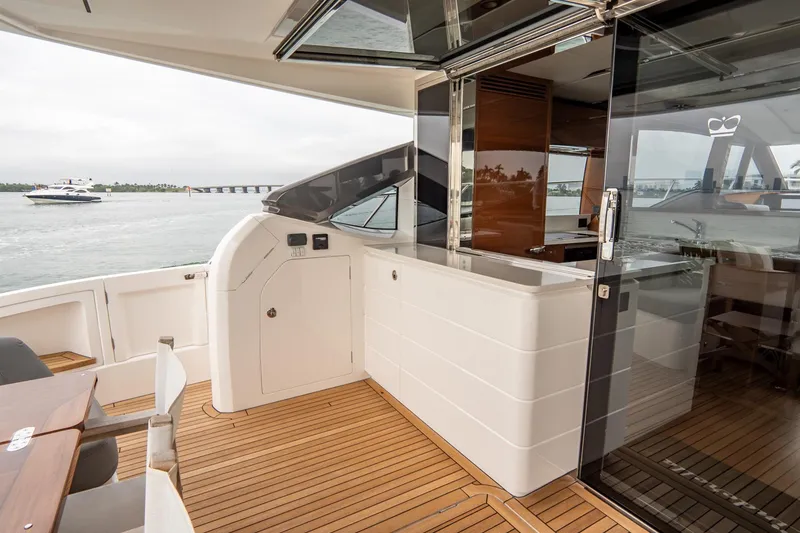 Slide: The Image of Luxurious 2017 Princess S65 yacht deck with sleek design and wooden flooring. - 45