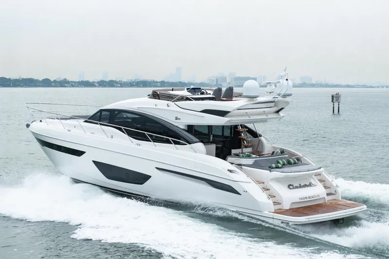 Slide: The Image of 2017 Princess S65 yacht cruising on open water, showcasing sleek design and luxury features. - 29