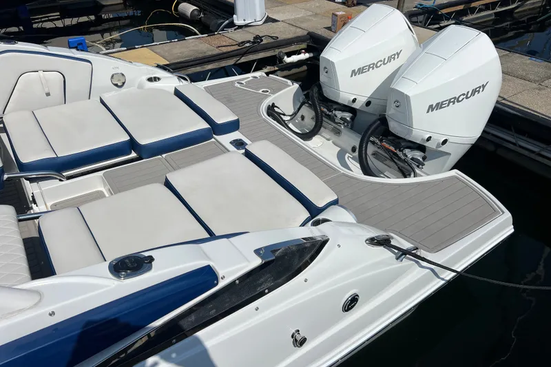 Slide: The Image of 2022 Crownline Eclipse E305 XS boat with dual Mercury outboard engines and spacious seating. - 11