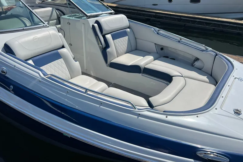 Slide: The Image of 2022 Crownline Eclipse E305 XS boat with luxurious seating and sleek design. - 17