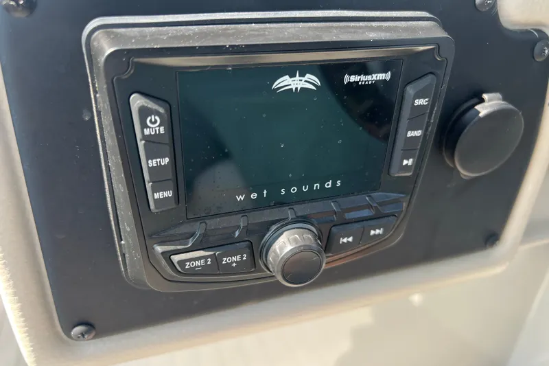 Slide: The Image of Wet Sounds audio system on 2022 Crownline Eclipse E305 XS boat dashboard. - 27