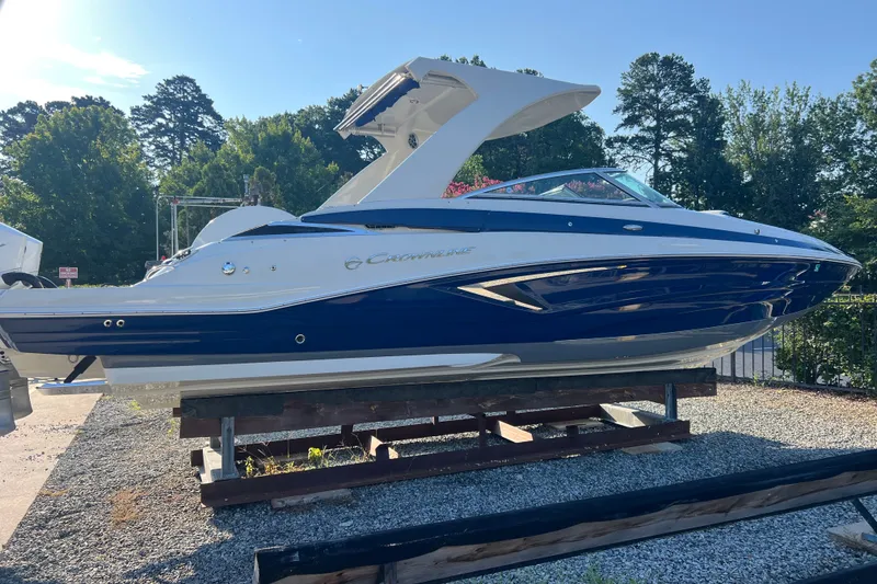 Slide: The Image of 2022 Crownline Eclipse E305 XS boat on display, featuring sleek design and modern aesthetics. - 1