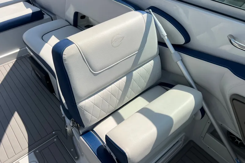 Slide: The Image of 2022 Crownline Eclipse E305 XS boat interior with white and blue seating. - 30