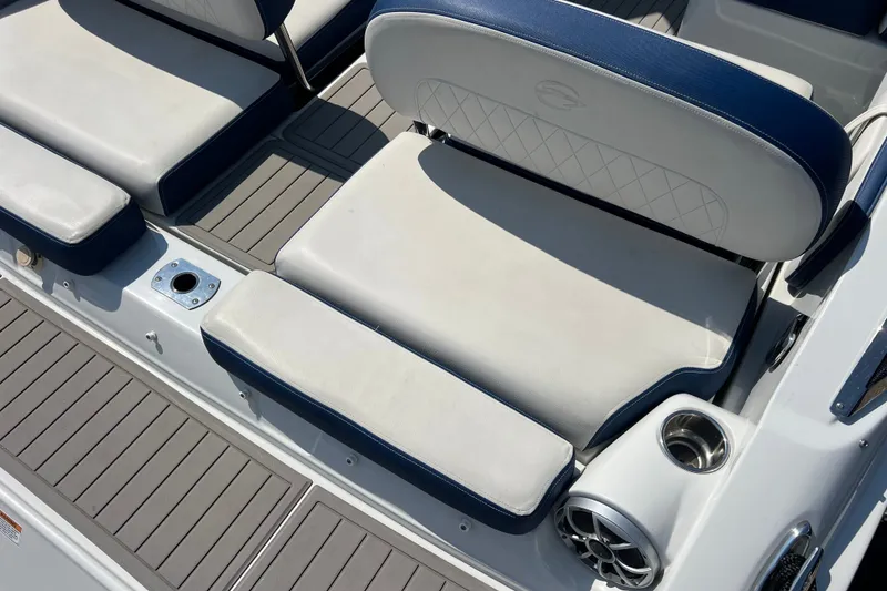 Slide: The Image of 2022 Crownline Eclipse E305 XS boat seating with cup holder and speaker. - 40