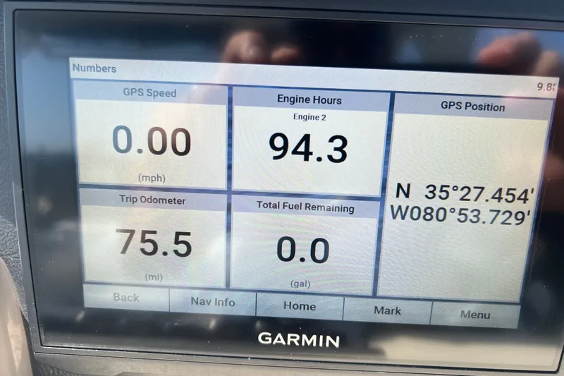 Slide: The Image of Garmin display on 2022 Crownline Eclipse E305 XS showing GPS speed, engine hours, and trip odometer. - 22