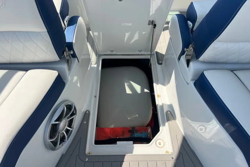 Slide: The Image of 2022 Crownline Eclipse E305 XS boat interior with open storage compartment. - 35