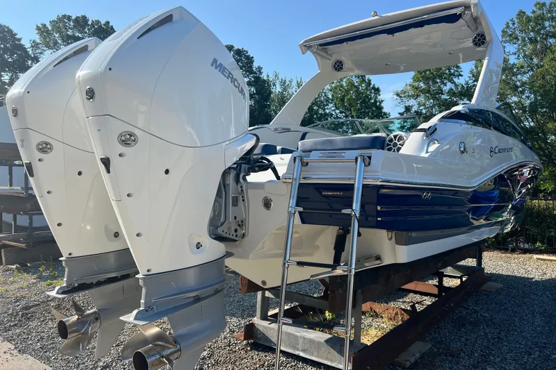 Slide: The Image of 2022 Crownline Eclipse E305 XS boat with dual Mercury outboard engines. - 6