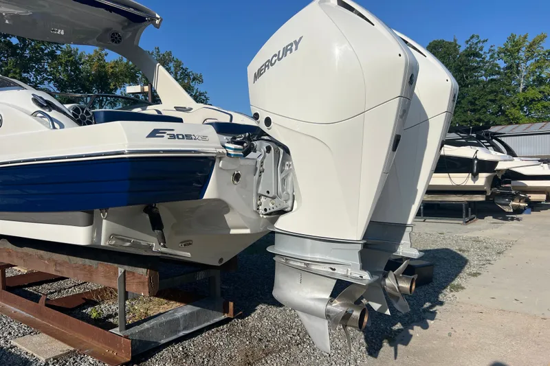 Slide: The Image of 2022 Crownline Eclipse E305 XS boat with dual Mercury outboard engines. - 7