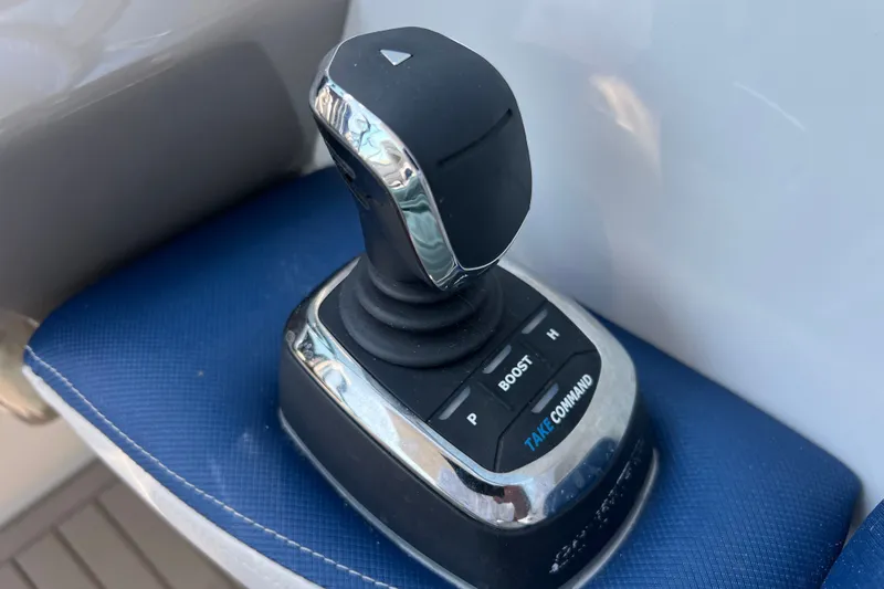 Slide: The Image of Joystick control on 2022 Crownline Eclipse E305 XS boat, featuring "Take Command" and "Boost" buttons. - 26