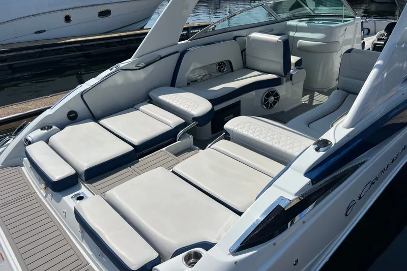Slide: The Image of 2022 Crownline Eclipse E305 XS boat interior with luxurious seating and modern design. - 14