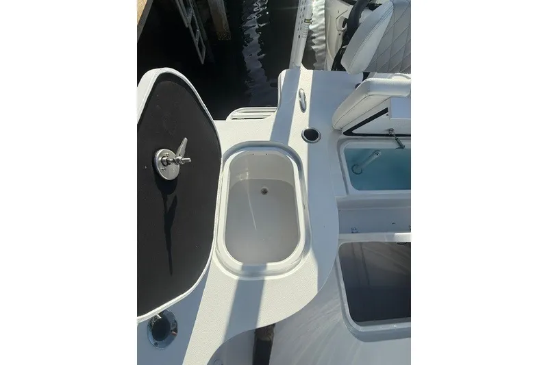 Slide: The Image of 2027 Conch 25 boat interior with storage compartments and seating. - 8