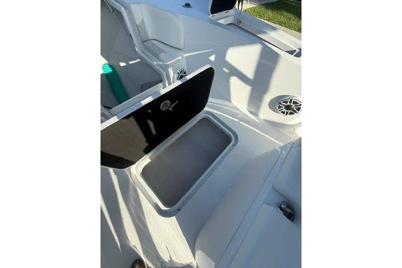 Slide: The Image of Open storage compartment on a 2027 Conch 25 boat, showcasing interior space and design. - 11