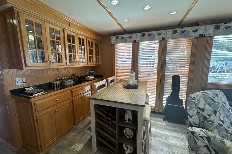 Slide: The Image of Cozy kitchen in 2004 Lakeview model with wooden cabinets and large windows. - 5